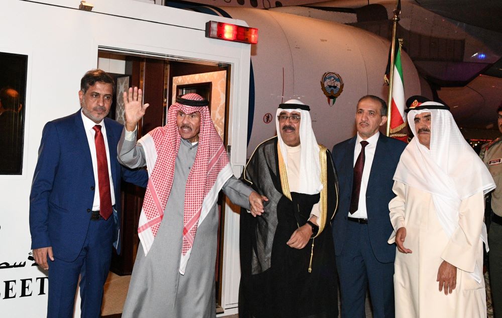 KUWAIT: His Highness the Amir Sheikh Nawaf Al-Ahmad Al-Jaber Al-Sabah is welcomed by His Highness the Crown Prince Sheikh Mishal Al-Ahmad Al-Jaber Al-Sabah upon his return to Kuwait. - Amiri Diwan photo