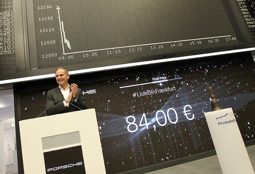 FRANKFURT, Germany: Oliver Blume, CEO of German car producer Porsche AG, stands in front of a board displaying the chart of Germany's share index DAX during the launch of Porsche's initial public offering (IPO) at the Frankfurt Stock Exchange in Frankfurt am Main, western Germany, on September 29, 2022. – AFP