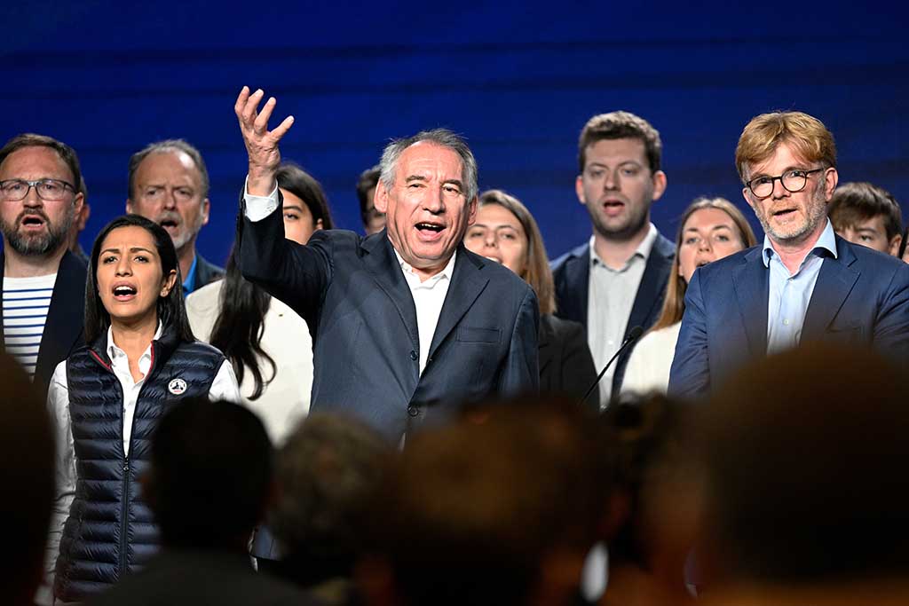 GUIDEL, France: Centrist Mouvement Democrate (MoDem) party's leader Francois Bayrou (C) sings the national anthem with French Agriculture Minister Marc Fesneau (R) speaks during MoDem's summer university meeting in Guidel, western France. – AFP