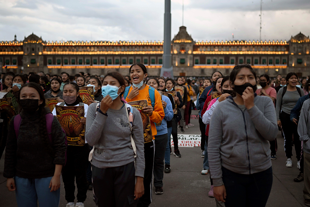 MEXICO CITY, Mexico: People shout slogans during a march at the Zocalo square in Mexico City to mark the eighth anniversary of the disappearance of 43 students of the teaching training school in Ayotzinapa. – AFP