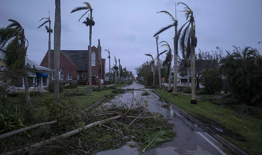 PUNTA GORDA, United States: Debris litters a street in the aftermath of Hurricane Ian in Punta Gorda, Florida on September 29, 2022. – AFP