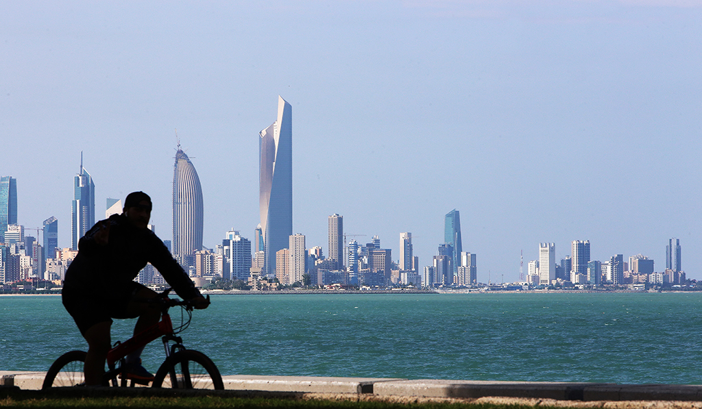 KUWAIT: A cyclist stops to appreciate Kuwait’s skyline. – Photo by Yasser Al-Zayyat