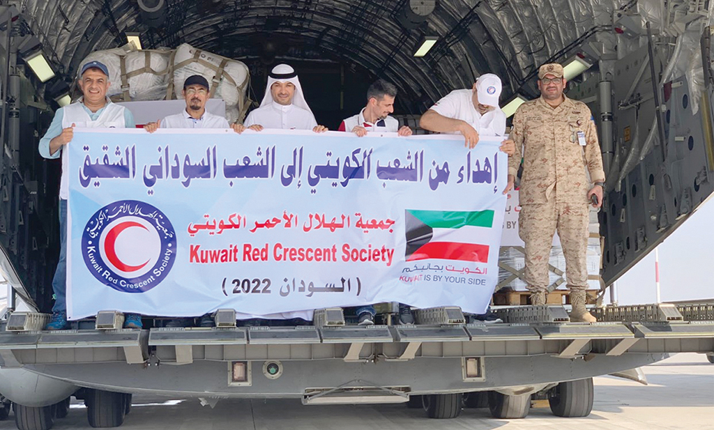 KUWAIT: Aid being loaded onto the plane at the base. - KUNA