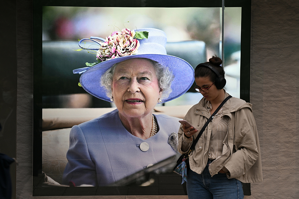 An image of Britain's Queen Elizabeth II is seen in the window of a high street store in Edinburgh.- AFP