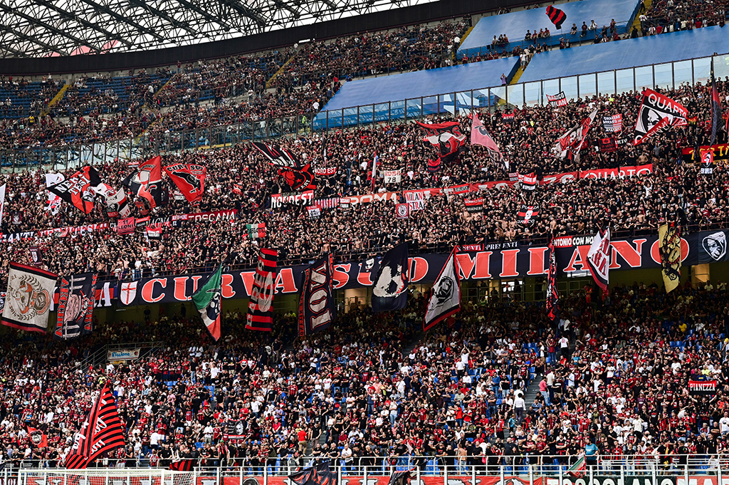 MILAN: AC Milan’s supporters cheer during the UEFA Champions League at the San Siro stadium in Milan.- AFP