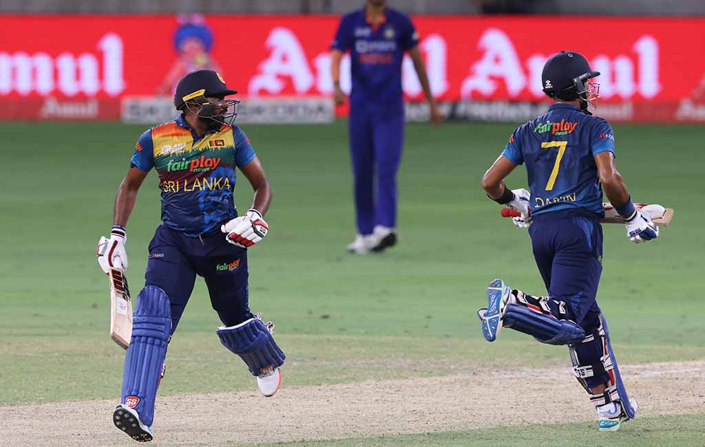 DUBAI: Sri Lanka's captain Dasun Shanaka (right) and Bhanuka Rajapaksa take a run during the Asia Cup Twenty20 international cricket Super Four match between India and Sri Lanka on September 6, 2022. - AFP