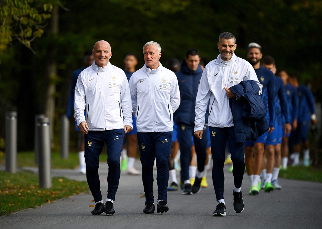 YVELINES: (From left) France’s head coach Guy Stephan, France’s head coach Didier Deschamps and France’s physical trainer Cyril Moine arrive for a training session in Clairefontaine-en-Yvelines on September 20, 2022 as part of the team’s preparation for the upcoming UEFA Nations League. – AFP