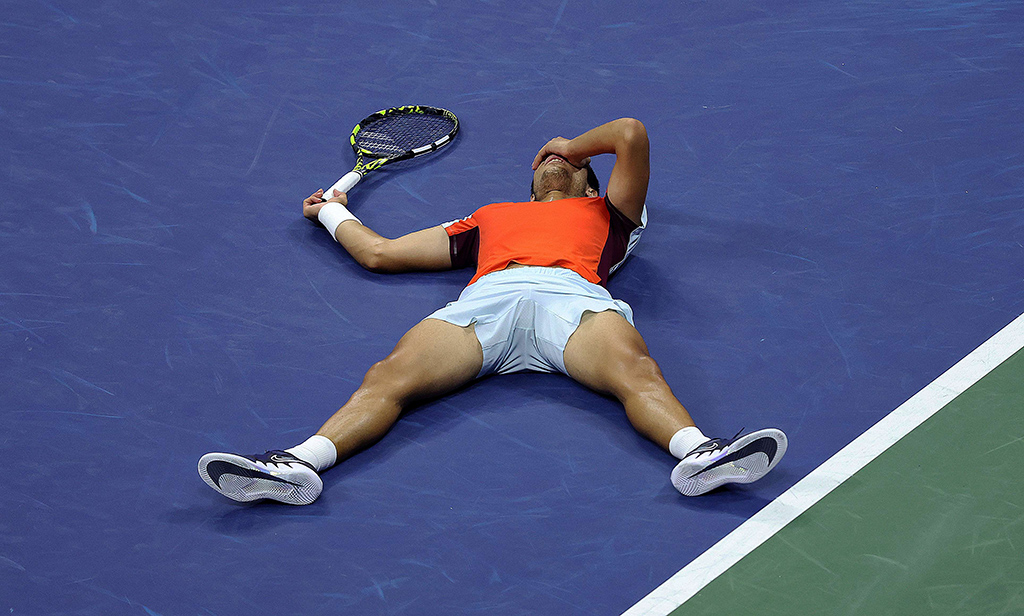 NEW YORK: Carlos Alcaraz of Spain celebrates match point against Jannik Sinner of Italy after going 5 sets and over 5 hours during their Men's Singles Quarterfinal match on Day Ten of the 2022 US Open on September 07, 2022.- AFP