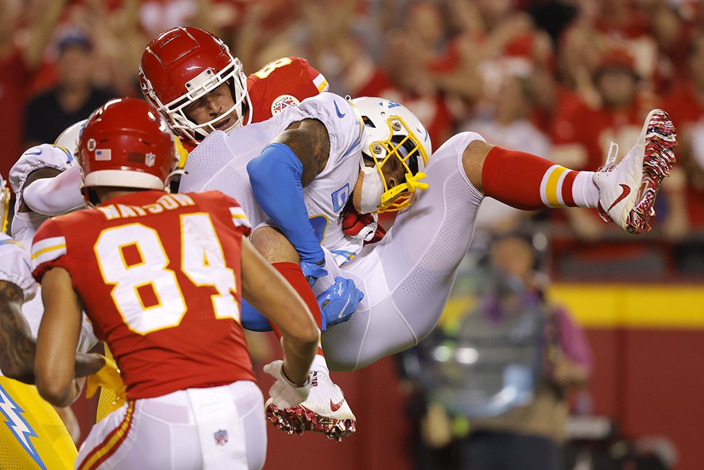 KANSAS CITY: Derwin James Jr #3 of the Los Angeles Chargers tackles Travis Kelce #87 of the Kansas City Chiefs during the third quarter at Arrowhead Stadium in Kansas City, Missouri. - AFP