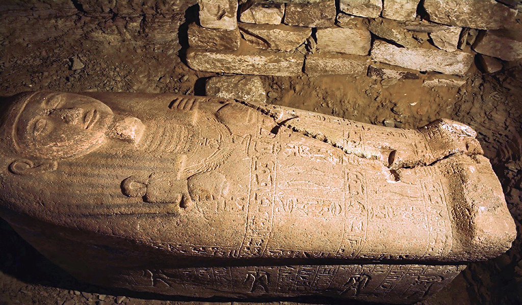 SAQQARA, Egypt: A handout picture released on Sept 19, 2022 shows a pink granite sarcophagus belonging to a government official, found by an expedition at the tomb of Ptah-em-uya near the Pyramid of Unas. - AFP