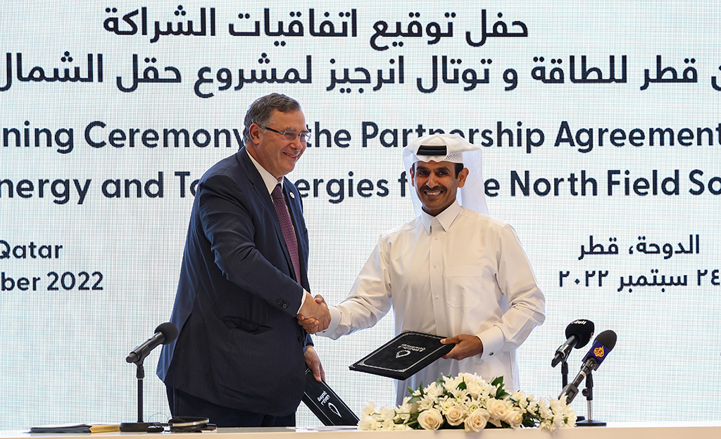 DOHA: (Right to left) Saad Sherida al-Kaabi, Qatar's Minister of State for Energy Affairs and President of QatarEnergy, and Patrick Pouyanne, CEO of French energy group TotalEnergies, shake hands during a signing ceremony at the QatarEnergy headquarters in Doha on September 24, 2022. - AFP