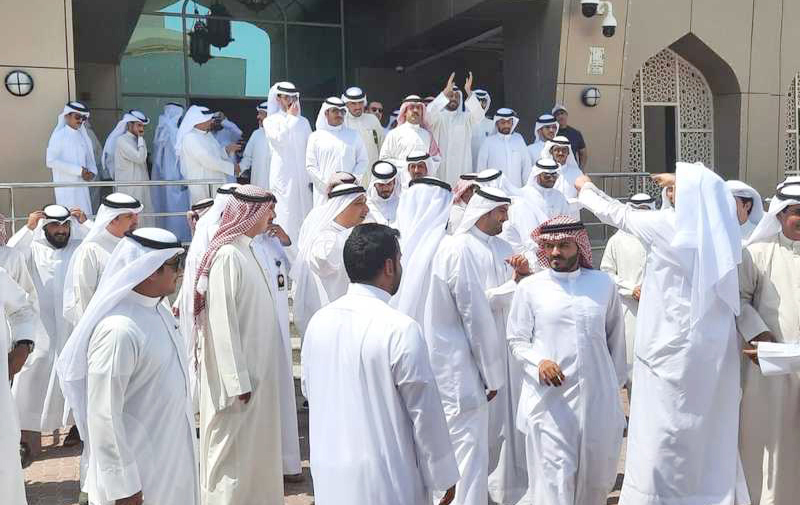 KUWAIT: Hygiene inspectors protest before the Kuwait Municipality Headquarters.