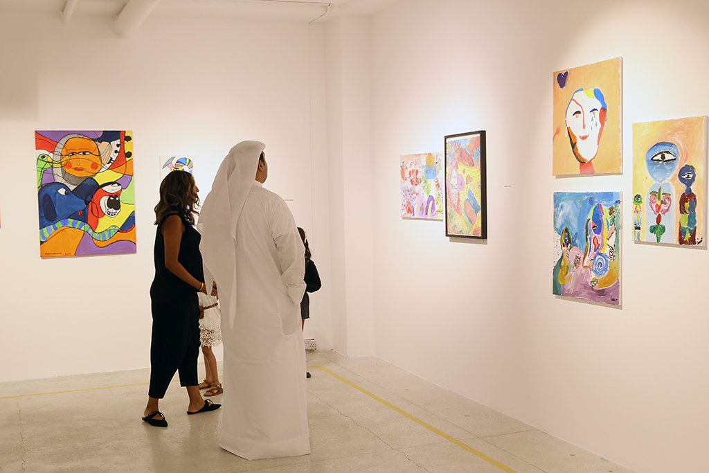 KUWAIT: Visitors at the art exhibition.