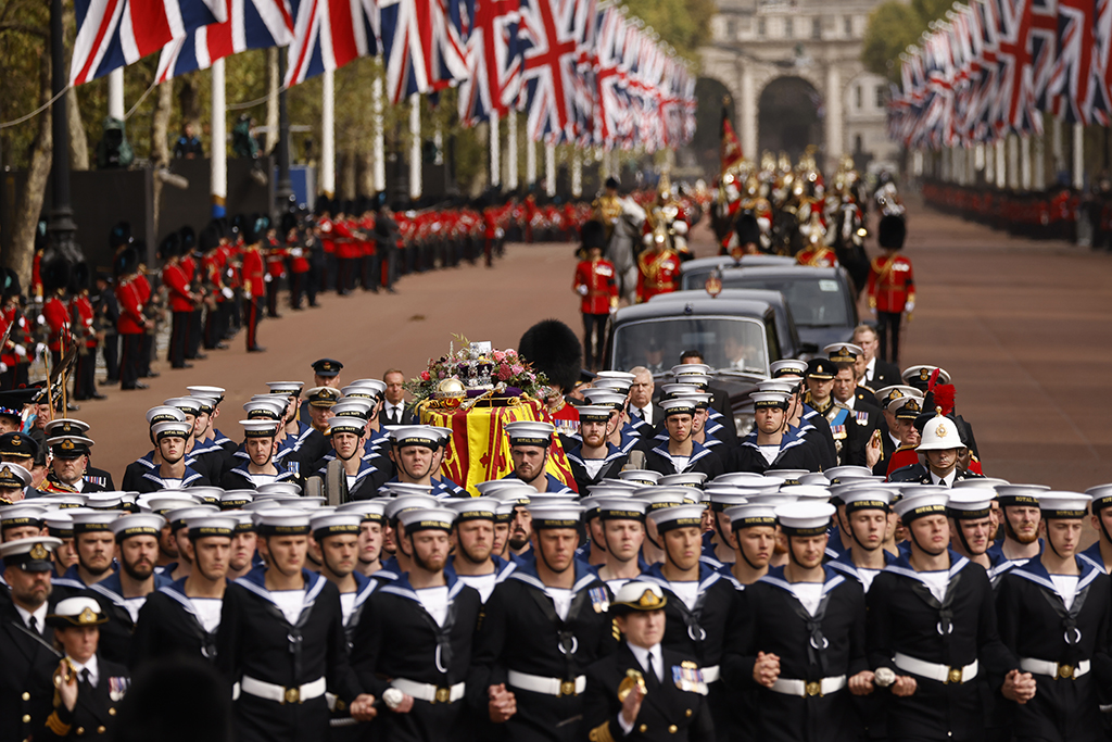 LONDON: Royal Navy Sailors walk ahead and behind the coffin of Queen Elizabeth II, draped in the Royal Standard, as it travels on the State Gun Carriage of the Royal Navy from Westminster Abbey to Wellington Arch in London. – AFP