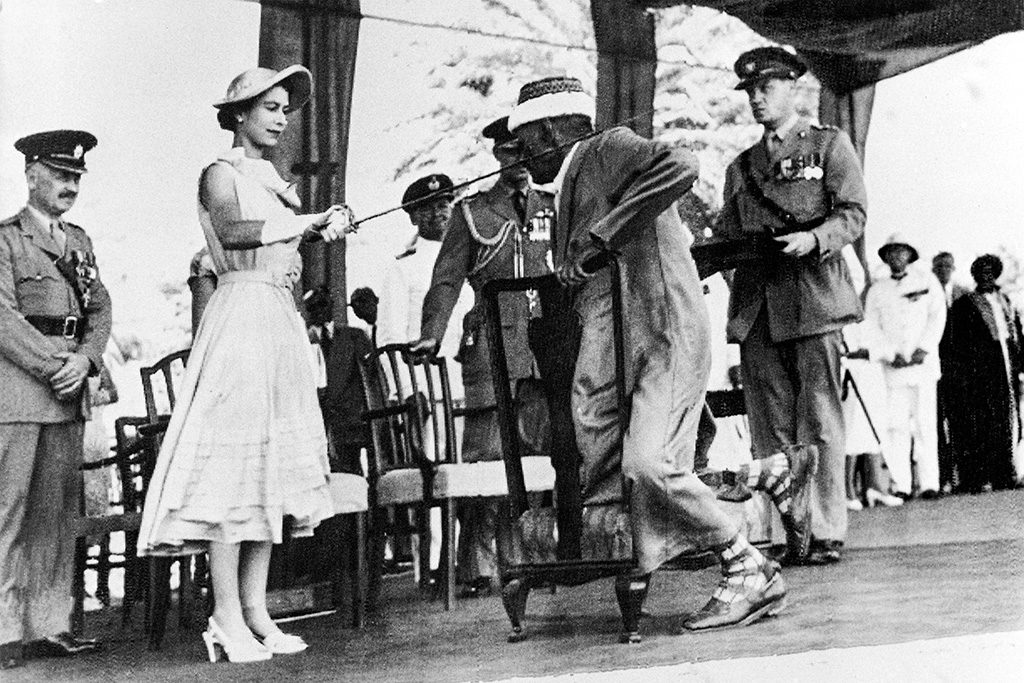 ADEN, Yemen: In this file photo Yemen's councillor Sayyid Abubakr bin Shaikh Alkaff kneels before Queen Elizabeth II to be knighted during the Sovereign visit to Aden, on April 29, 1954. - AFP
