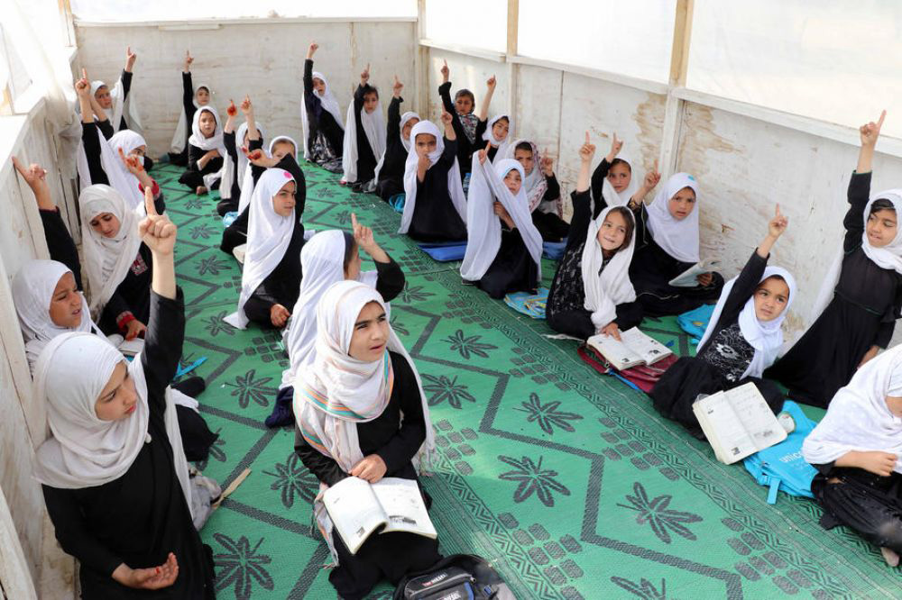 KABUL: Afghan girls of up to primary grades attend a class at their school in Kandahar, Afghanistan, March 23, 2022. The UN today urged the Taleban to reopen high schools for girls across Afghanistan, condemning the ban that began exactly a year ago as ‘tragic and shameful’. - AFP