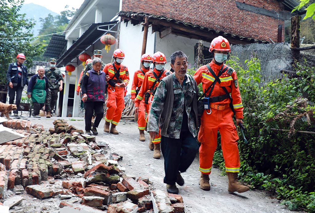 YA'AN, China: This photo taken on Sept 7, 2022 shows rescuers evacuating residents following a 6.6-magnitude earthquake that struck on Sept 5 in China's southwestern Sichuan province. - AFP