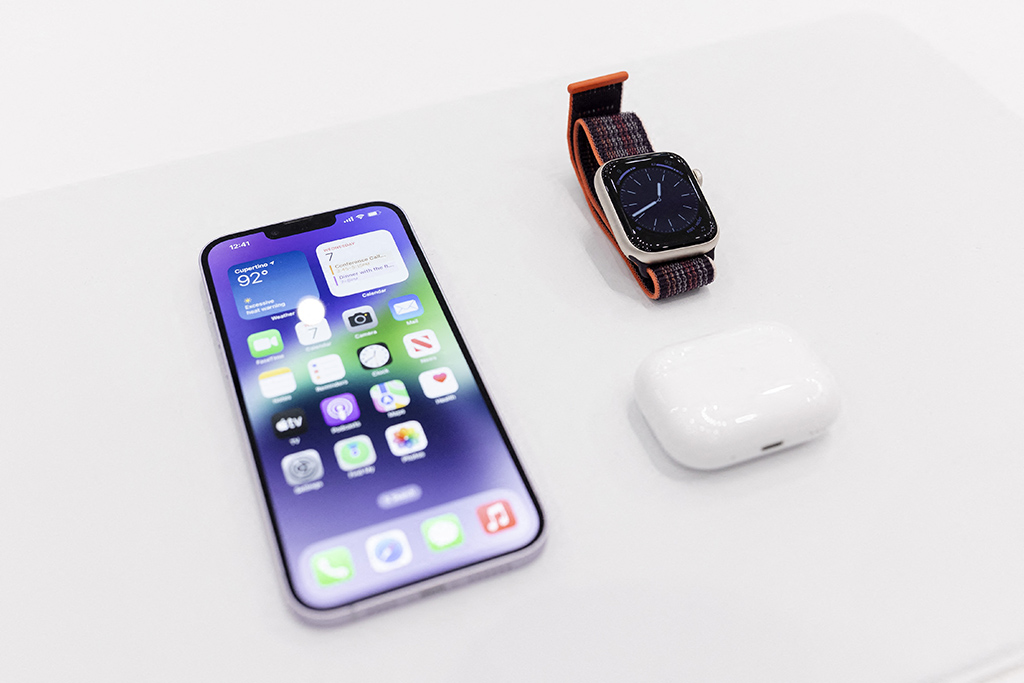 CALIFORNIA: The new iPhone 14 is displayed alongside the new Apple Watch 8 Series and new AirPod Pros during a launch event for new products at Apple Park in Cupertino, California, on September 7, 2022. - AFP