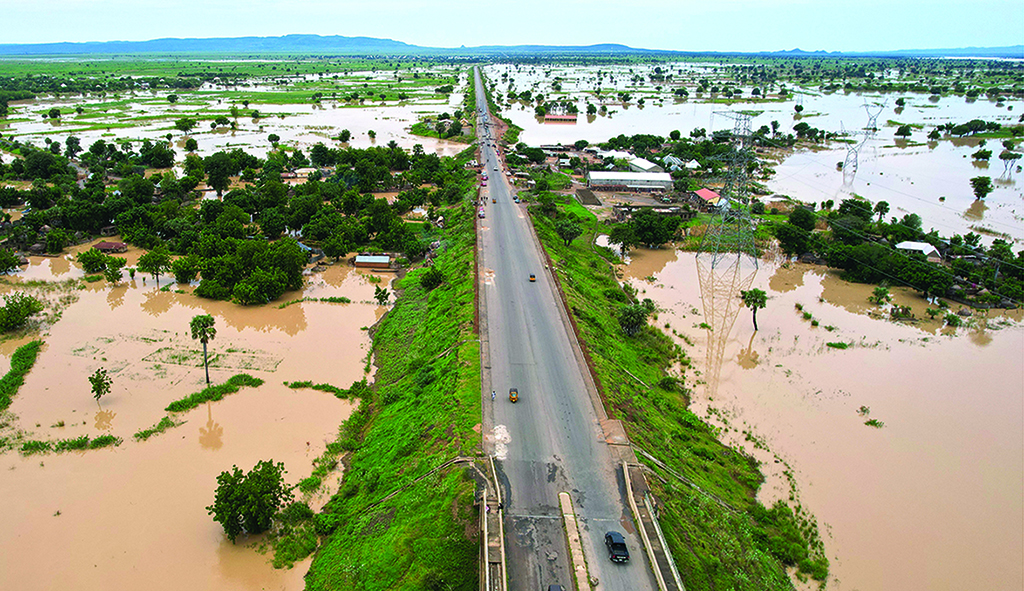 NUMAN, Nigeria: This aerial view shows the nearly submerged community of Imburu on September 25, 2022 in Adamawa State - North East Nigeria. - AFP