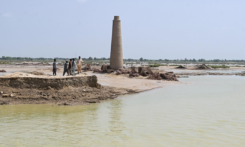 Though the floods that engulfed Aqilpur and its surrounding fields have receded from the highs of a week ago, the kilns are still surrounded by water. – AFP