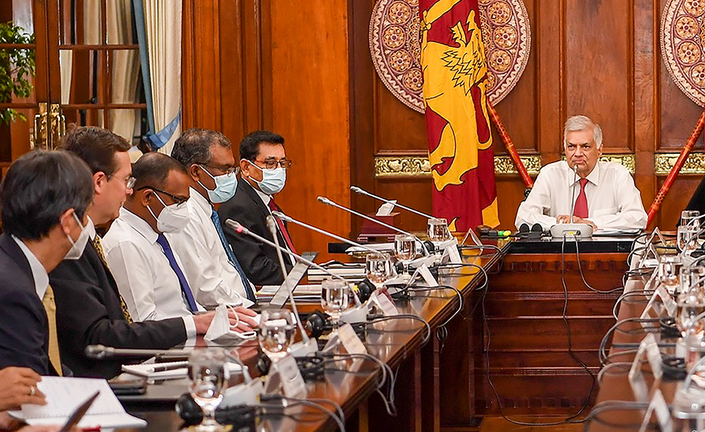 COLOMBO, Sri Lanka: This handout photograph taken and released on September 1, 2022 by Sri Lanka President's Office shows Sri Lanka's President Ranil Wickremesinghe (right) meeting with the senior mission chief for Sri Lanka of the International Monetary Fund (IMF) Peter Breuer (second left) in Colombo. - AFP
