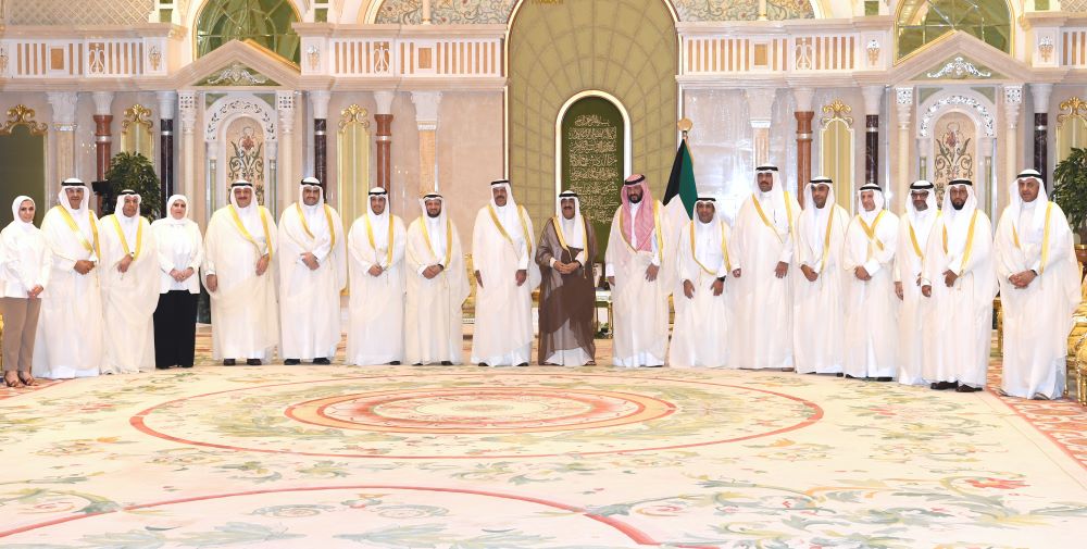KUWAIT: His Highness the Deputy Amir and Crown Prince Sheikh Mishal Al-Ahmad Al-Jaber Al-Sabah with the new Cabinet members. - Amiri Diwan photo
