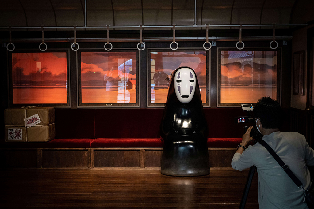 A member of the media takes video of an exhibit at Ghibli's Grand Warehouse during a media tour of the new Ghibli Park in Nagakute, Aichi prefecture.— AFP photos 