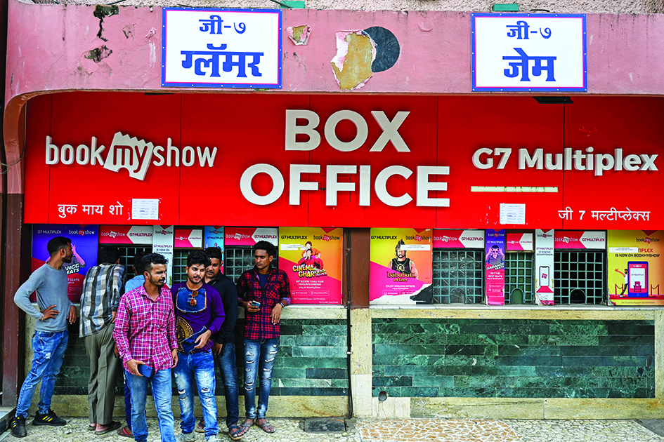 In this picture moviegoers wait at the ticket counters outside the G7 multiplex in Mumbai. – AFP photos