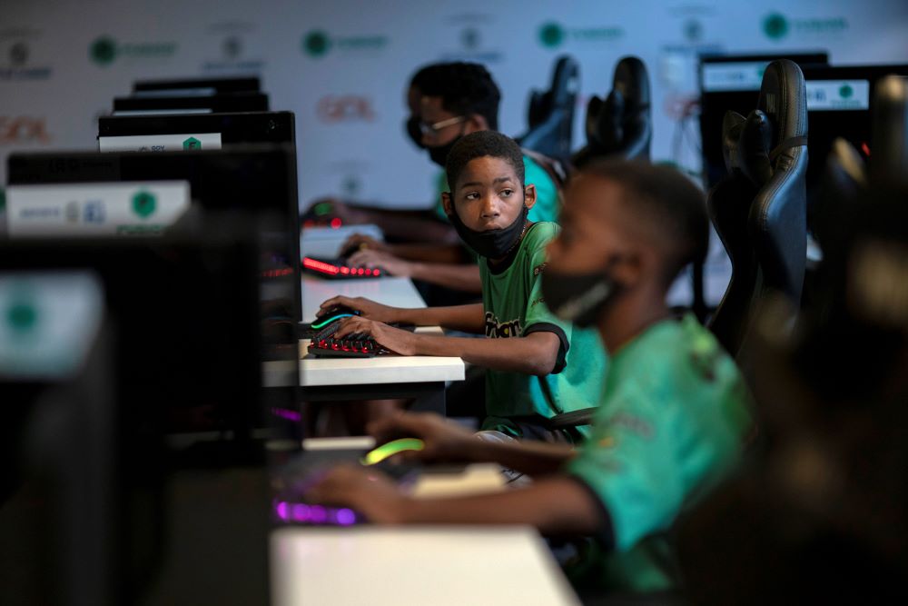 Rio de Janeiro: In this file photo taken on May 14, 2021 children play a video game called League of Legends (LoL) during a game tactics class at the NGO AfroReggae headquarters of the Vigario Geral favela in Rio de Janeiro, Brazil. - AFP