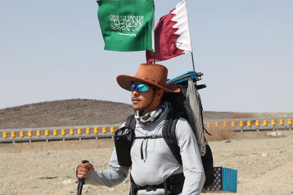  Saudi trekker Abdullah Alsulmi crosses a desert area near Al-Khasrah area, some 350Km west of Riyadh, during his solo trek to the Qatari capital ahead of the FIFA World Cup.--AFP 
