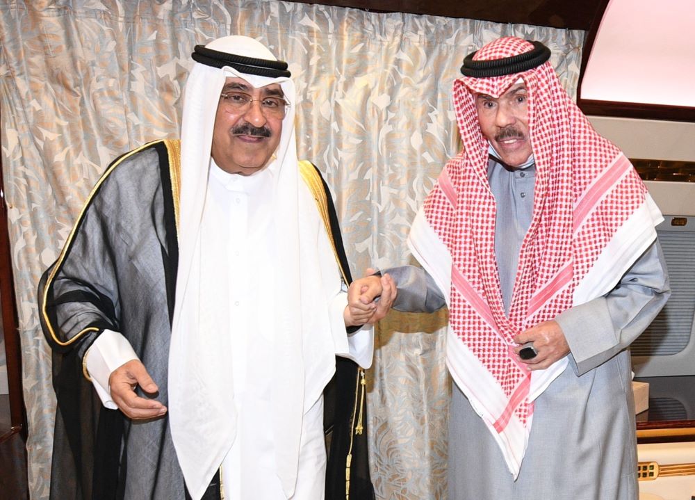 KUWAIT: His Highness the Amir Sheikh Nawaf Al-Ahmad Al-Jaber Al-Sabah is welcomed by His Highness the Crown Prince Sheikh Mishal Al-Ahmad Al-Jaber Al-Sabah upon his arrival to Kuwait. - Amiri Diwan photo