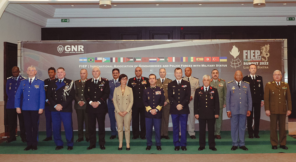 Top officials and participants take a group photo after the meeting in Portugal.