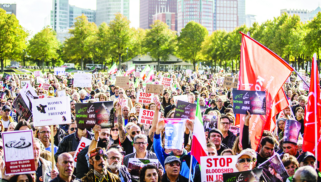THE HAGUE, Netherlands: People take part in a rally on the Malieveld following the death of the Iranian Mahsa Amini in The Hague. Amini, 22, died September 16, 2022, three days after falling into a coma following her arrest in Tehran by the morality police for allegedly breaching the Islamic republic's strict dress code for women. - AFP
