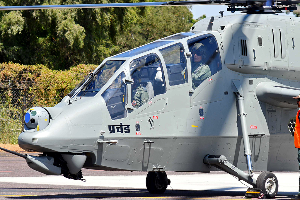 JODHPUR, India: India's Defence Minister Rajnath Singh sits in a locally-made light combat helicopter 'Prachand' during its induction ceremony at the air base in Jodhpur on October 3, 2022. – AFP