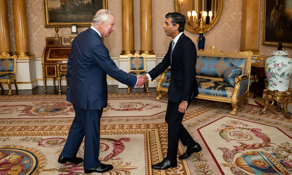 Britain's King Charles III greets newly appointed Conservative Party leader and incoming prime minister Rishi Sunak during an audience at Buckingham Palace in London on October 25, 2022.