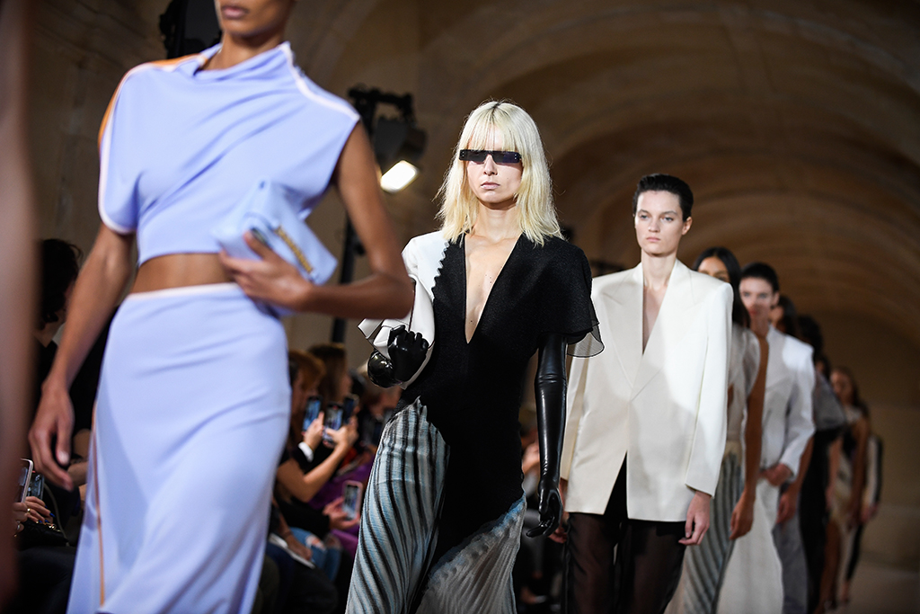 Models present creations for the Victoria Beckham Spring-Summer 2023 fashion show during the Paris Womenswear Fashion Week, in Paris, on September 30, 2022. - AFP photos