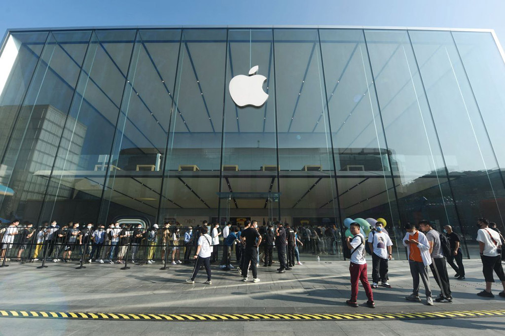 Customers queueing to buy iPhones at an Apple store in Hangzhou in China's eastern Zhejiang province. China's latest COVID-19 cases include an outbreak at a factory in the central city of Zhengzhou which is known as the largest producer of iPhones in the world. - AFP
