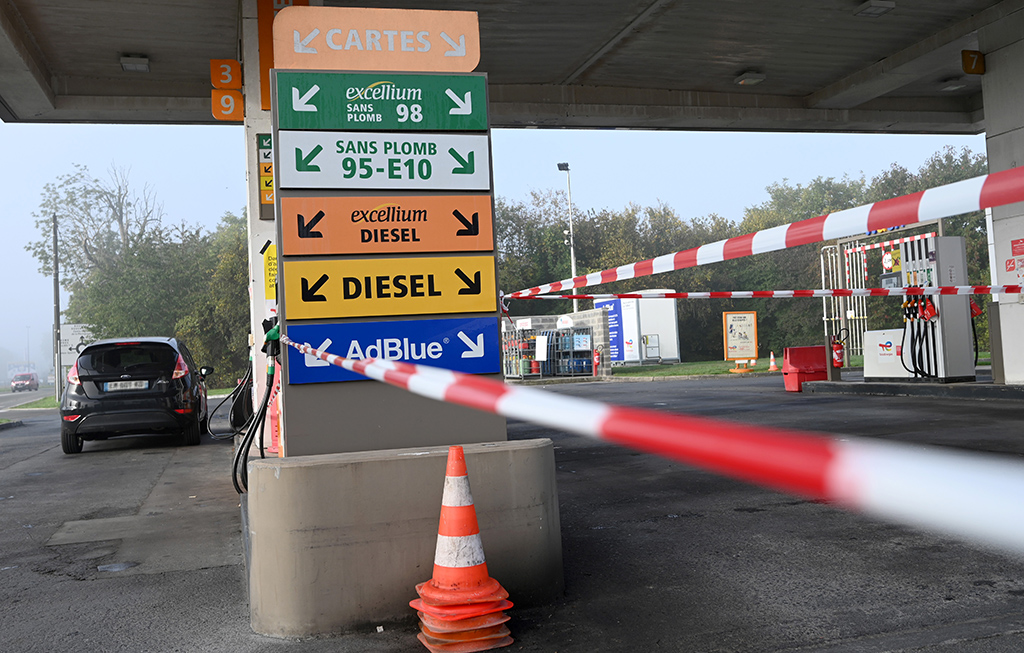 DOUCHY-LES-MINES, France: A security perimeter has been set for priority vehicles at a Total gas station in Douchy-les-Mines, northern France, as around a third of France’s service stations are still low on, or out of, petrol as strike action at energy giant TotalEnergies and other oil majors entered its third week. – AFP