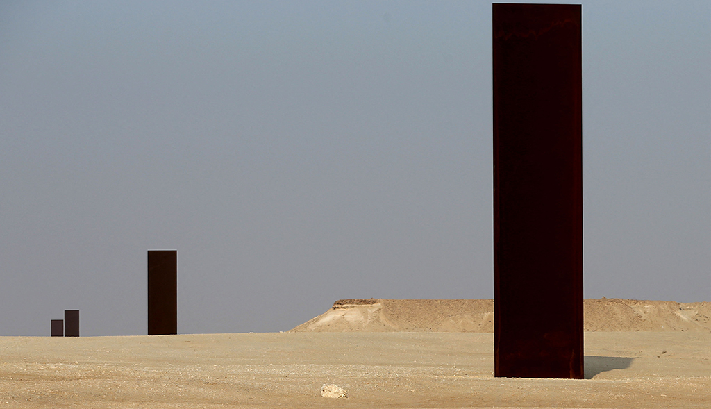 A general view shows the ‘East-West/West-East’ sculpture by American artist Richard Serra during sunset in Qatar’s Dukhan desert, west of the capital Doha.