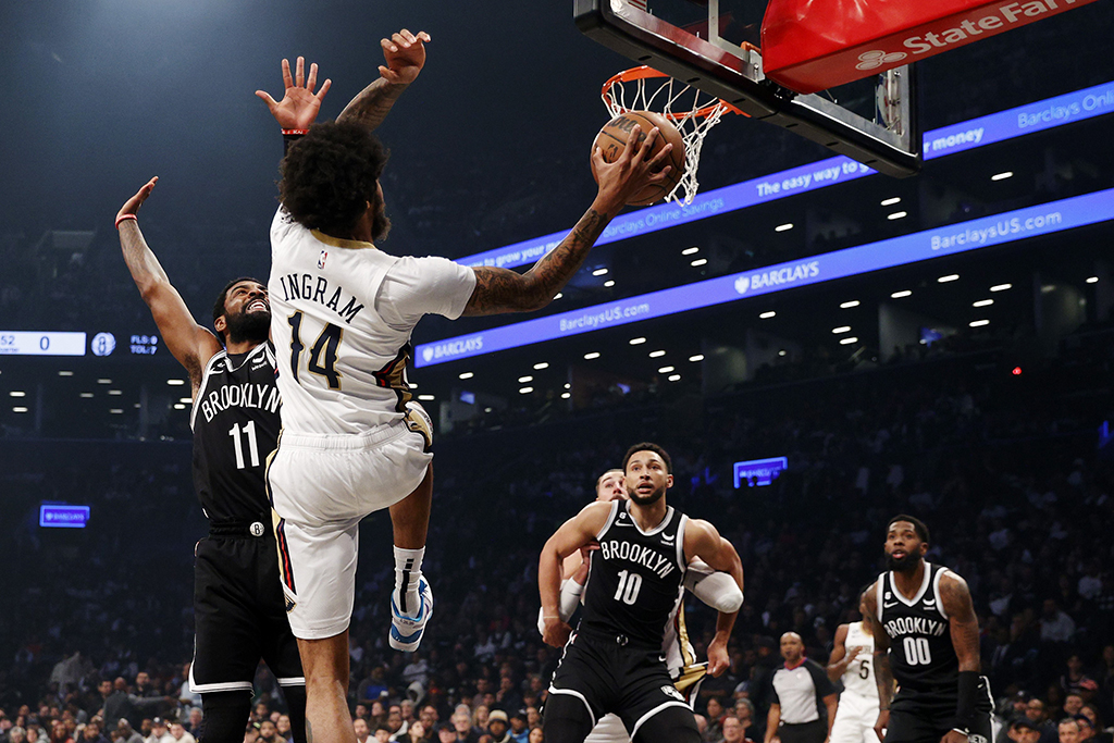 NEW YORK: Brandon Ingram #14 of the New Orleans Pelicans looks to pass as Kyrie Irving #11 of the Brooklyn Nets defends during the first half against the Brooklyn Nets at Barclays Center on October 19, 2022.- AFP