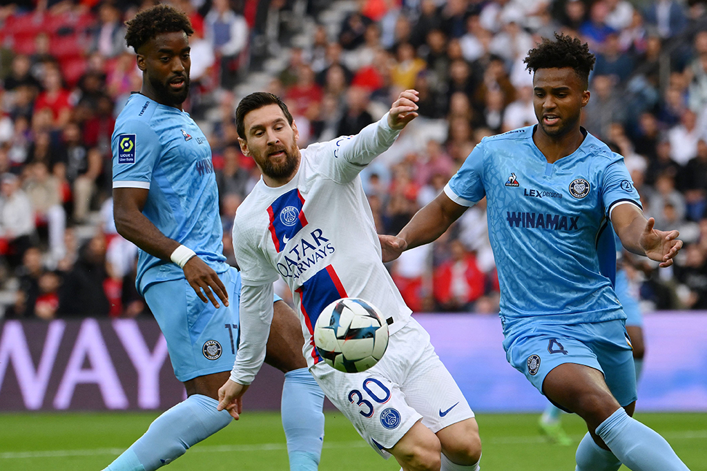 Paris : Paris Saint-Germain's Argentine forward Lionel Messi fights for the ball with Troyes' US defender Erik Palmer Browen at The Parc des Princes Stadium on Oct 29, 2022. – AFP