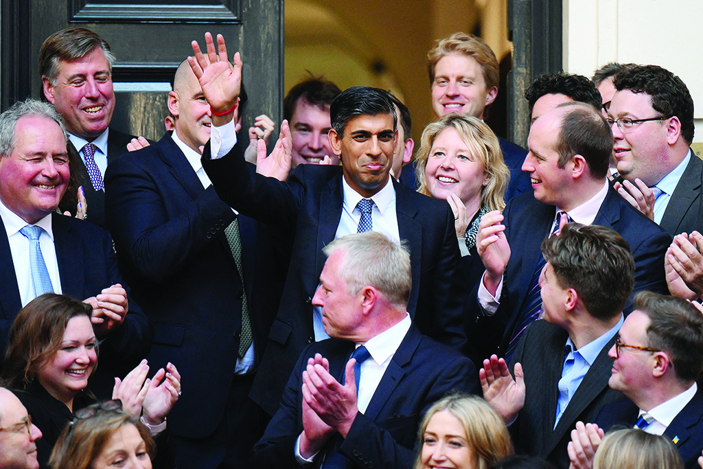 LONDON: New Conservative Party leader and incoming prime minister Rishi Sunak waves as he arrives at Conservative Party Headquarters on Oct 24, 2022. – AFP