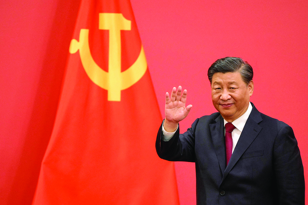 BEIJING: China's President Xi Jinping waves during the introduction of members of the Chinese Communist Party's new Politburo Standing Committee on Oct 23, 2022. - AFP