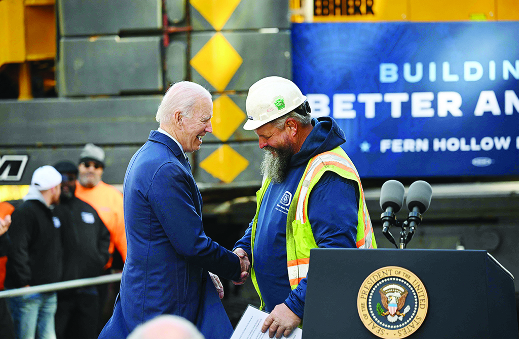 PITTSBURGH: US President Joe Biden greets a carpenter as he arrives to speaks about rebuilding the nation's infrastructure at the Fern Hallow Bridge on Oct 20, 2022. – AFP