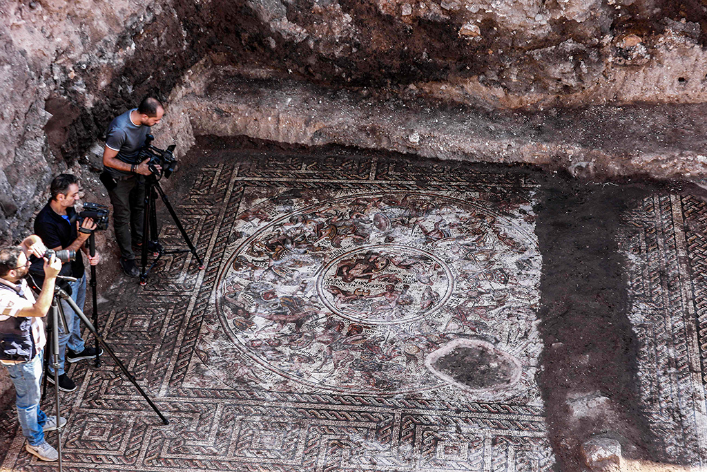 RASTAN: Journalists film at the site of a discovery of a mosaic floor dating to the Roman era on Oct 12, 2022. – AFP