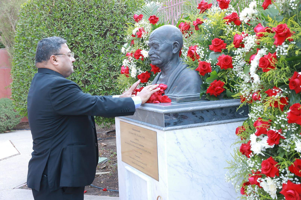 KUWAIT: Indian Ambassador Sibi George paying floral tributes at the Gandhi statue on Sunday.