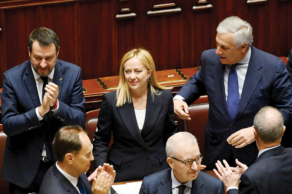 ROME: Italy's new Prime Minister Giorgia Meloni (C) is applauded by her cabinet members after her first address to parliament ahead of a confidence vote at Montecitirio palace in Rome. - AFP