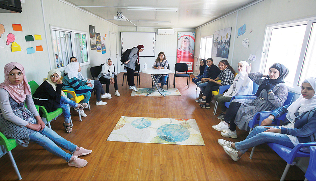 ZAATARI REFUGEE CAMP, Jordan: Refugee girls take part in awareness-raising activities at the Adolescent Girls Empowerment Led (AGEL) center at the Zaatari camp for Syrian refugees in Jordan. - AFP