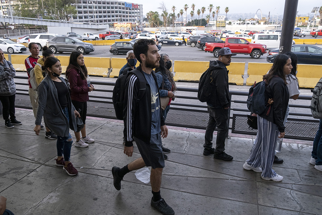 TIJUANA, Mexico: Gabriel Zarate (C), 38, a US teacher who lives in Tijuana but works in San Diego, in his home country, arrives at the San Ysidro crossing port in Tijuana, Baja California State, Mexico. – AFP