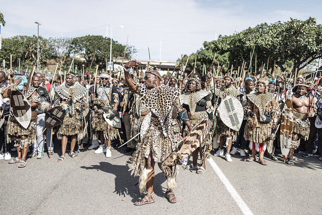 DURBAN: Amabutho, Zulu King regiments, clad in traditional dresses and carrying shields and sticks, are seen at the Moses Mabhida Stadium in Durban on October 29, 2022, for the handover of the official certificate of recognition for the Zulu King Misuzulu. – AFP